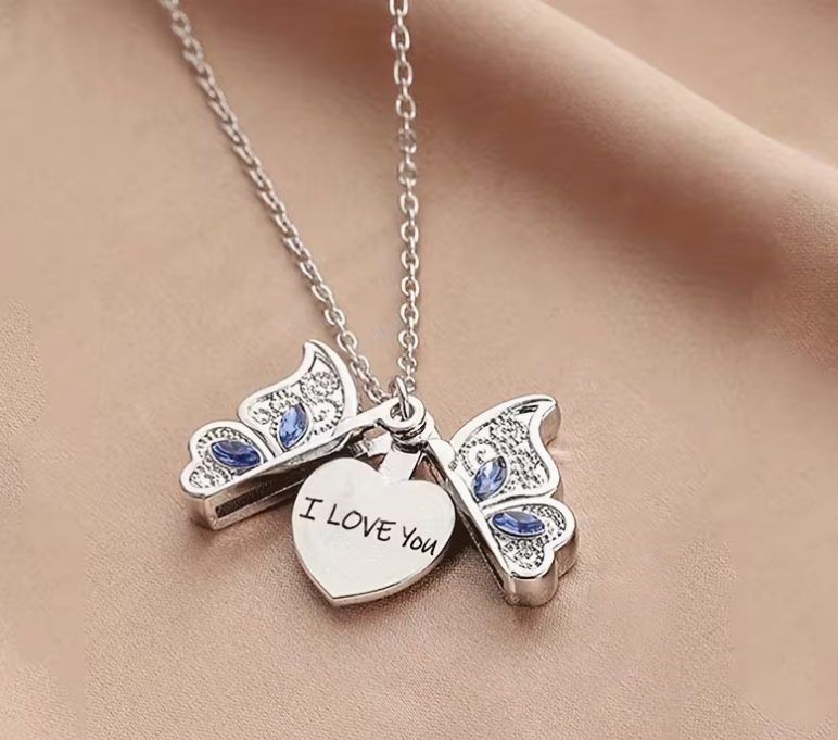 Open silver tone butterfly necklace revealing hidden heart engraved I Love You