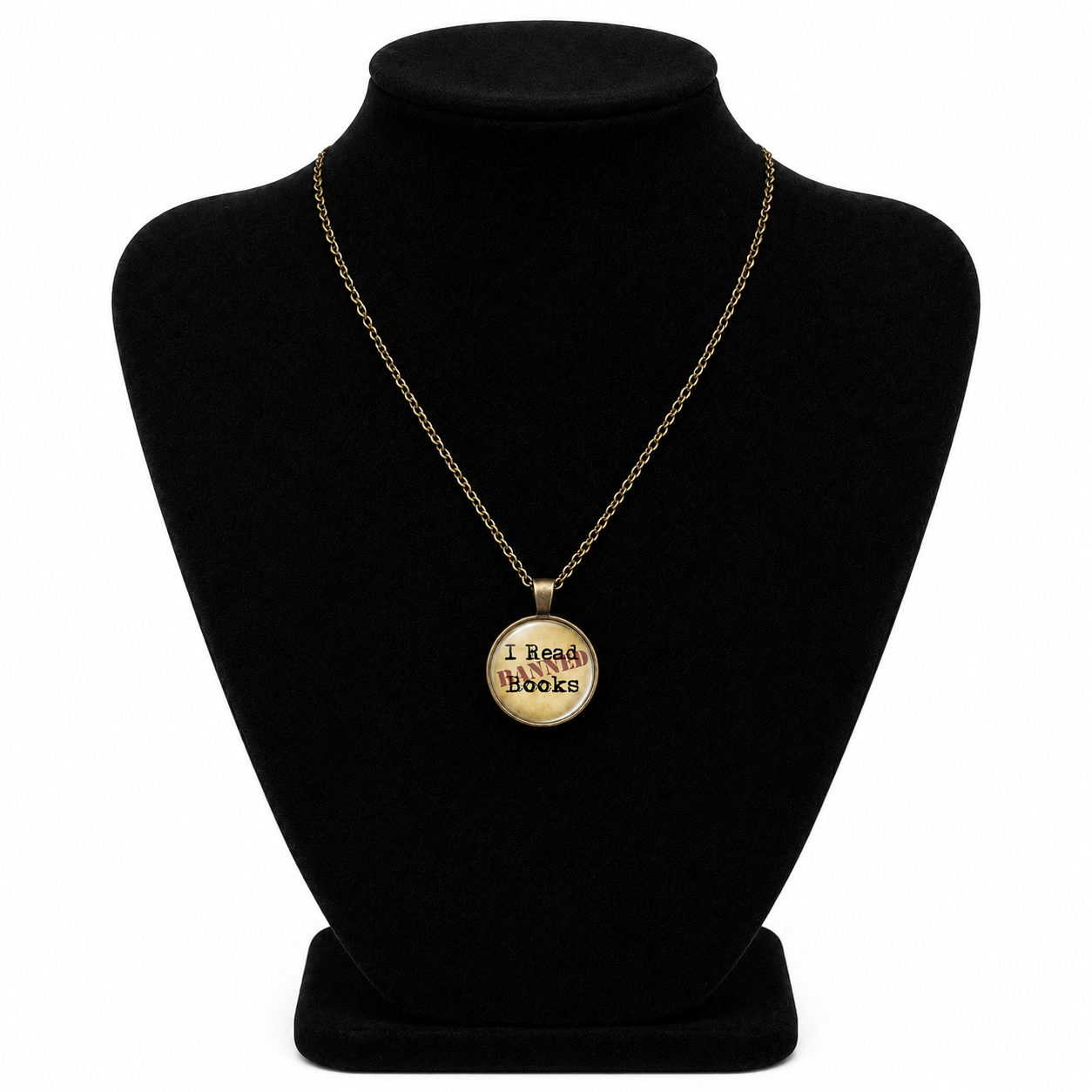 Vintage bronze-tone I Read Banned Books necklace with round glass literary pendant and matching chain.