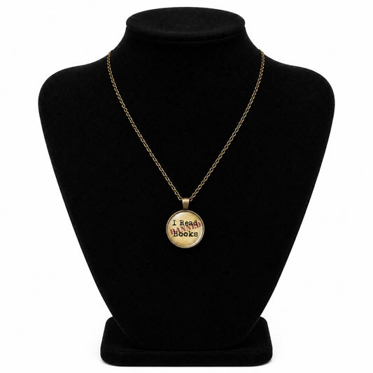 Vintage bronze-tone I Read Banned Books necklace with round glass literary pendant and matching chain.