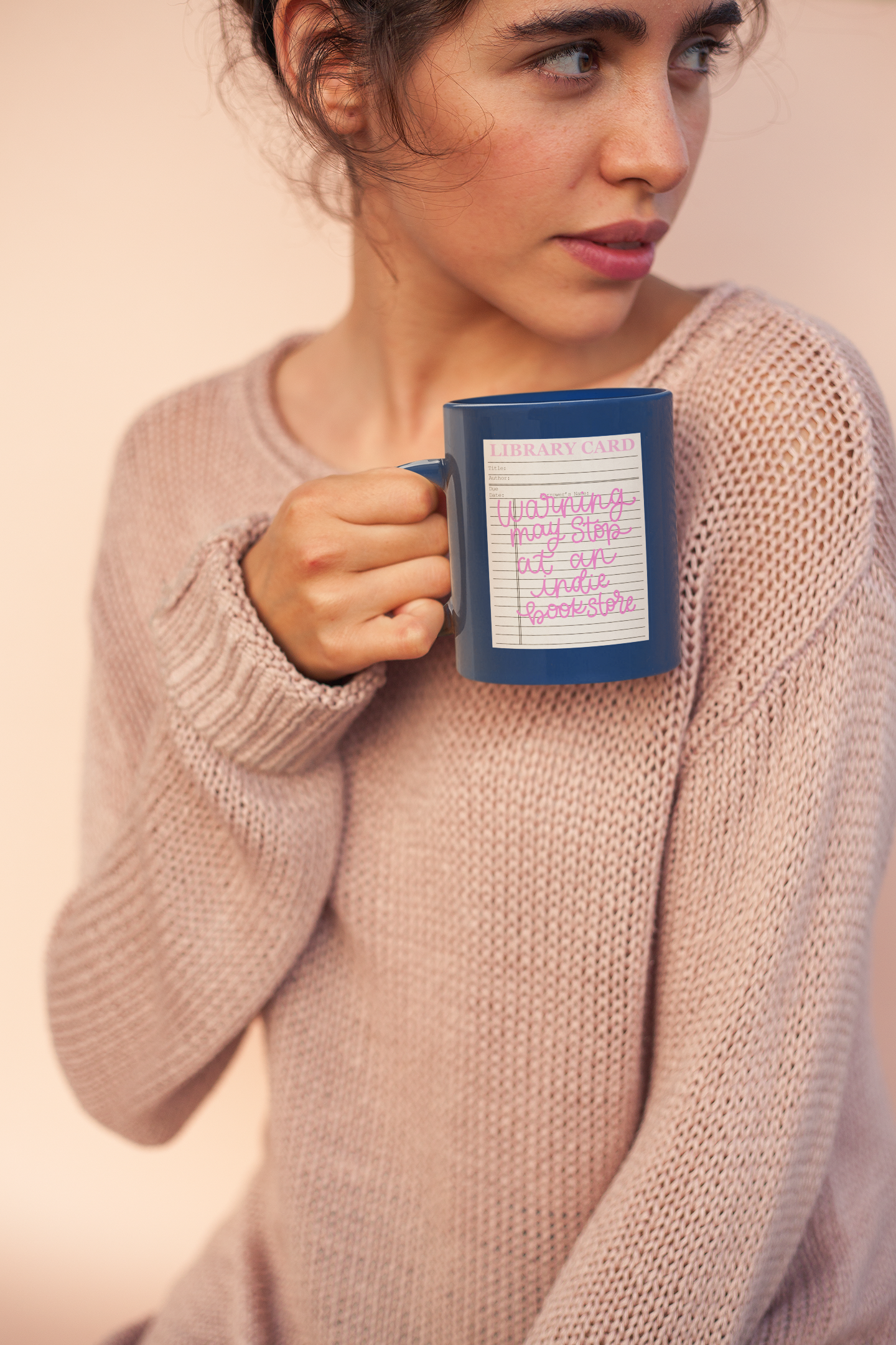library card style sticker that says warning may stop at an indie bookstore