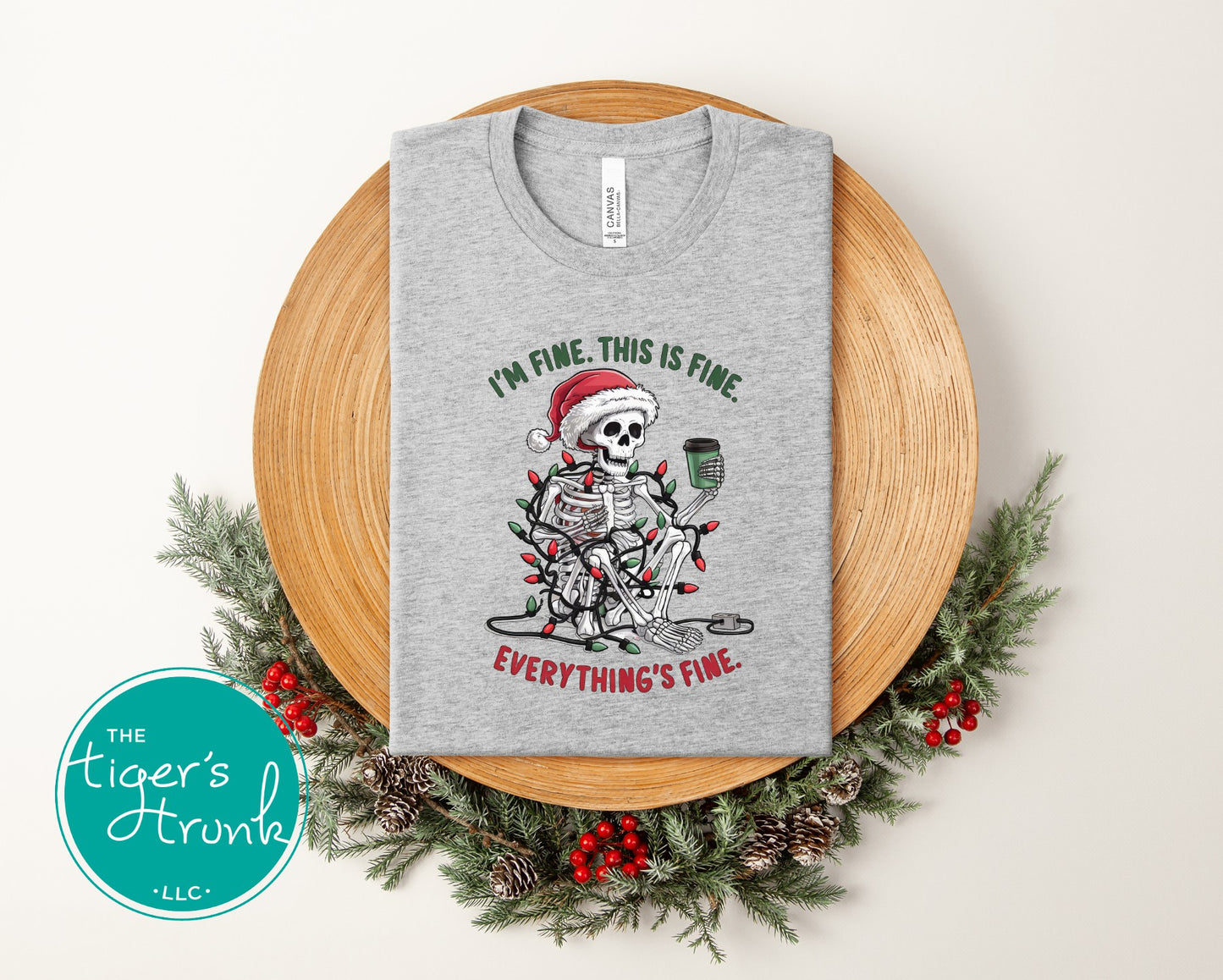 Athletic gray Christmas shirt with humorous skeleton design saying I’m Fine This Is Fine Everything’s Fine.