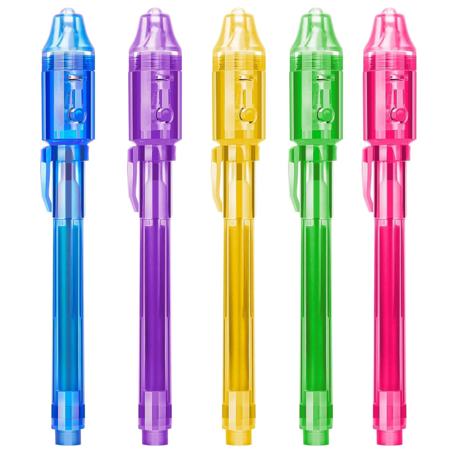 Colorful invisible ink spy pens shown in a row with UV light caps