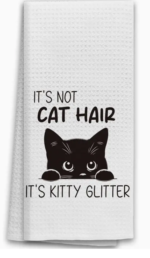 White towel with black text and a black cat illustration on a white background