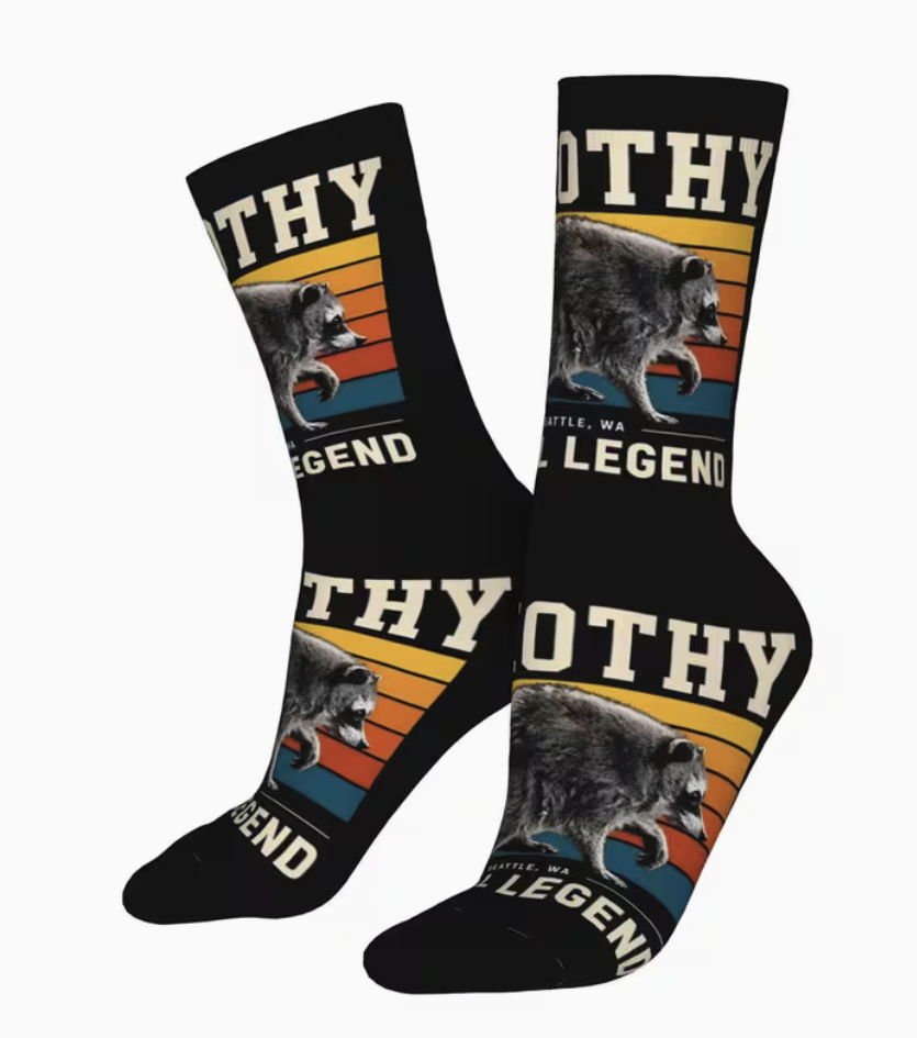One pair of black Jimothy raccoon novelty crew socks with Feral Legend design