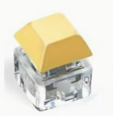 pastel yellow colored keyboard fidget toy keychains with clicky mechanical keyboard style buttons