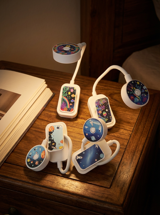 Multiple phone holders with colorful designs on a wooden surface