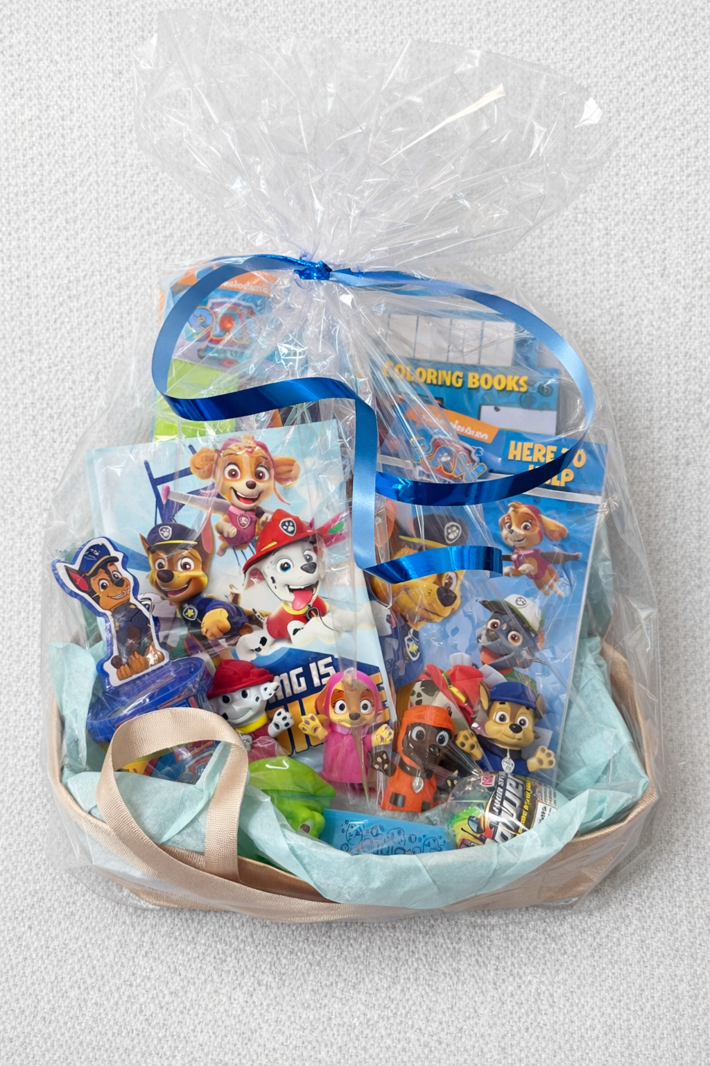 Pre wrapped kids character gift basket with toys coloring books and activity items ready to gift