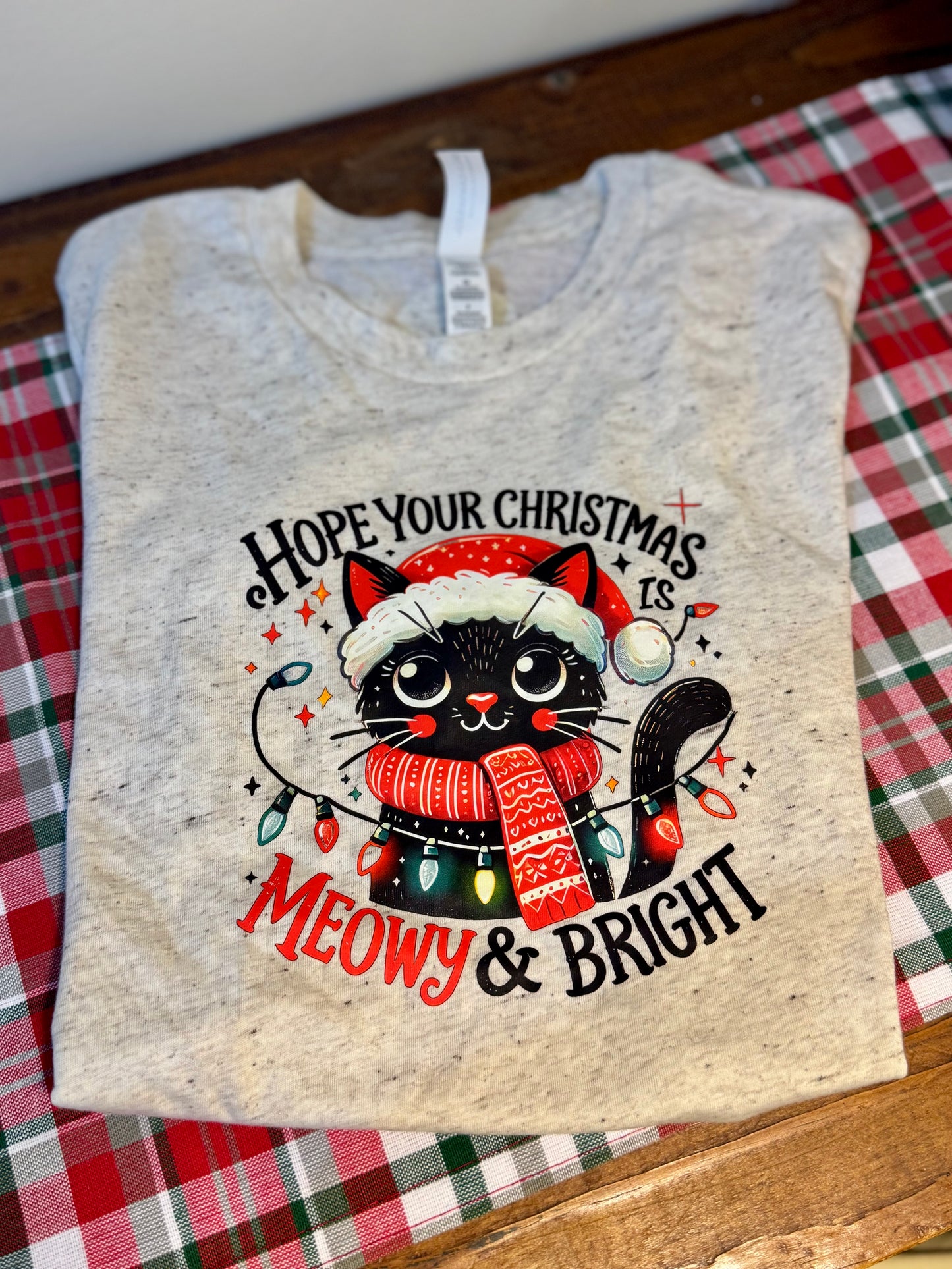Heathered Christmas shirt, size 6-8, with a cat design and "Hope Your Christmas is Meowy & Bright" festive phrase.