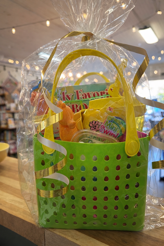 Kids summer gift basket with My Favorite Book and toys in bright green tote bag wrapped for gifting