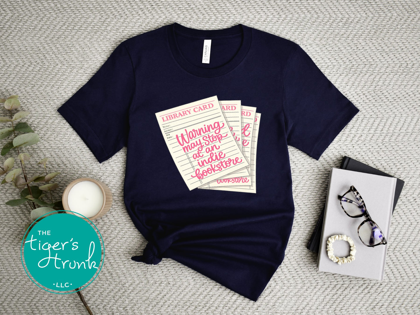 Library card shirt with warning may stop at an indie bookstore design on cream, navy, mauve, sage, sand, fatigue green, and maroon shirts