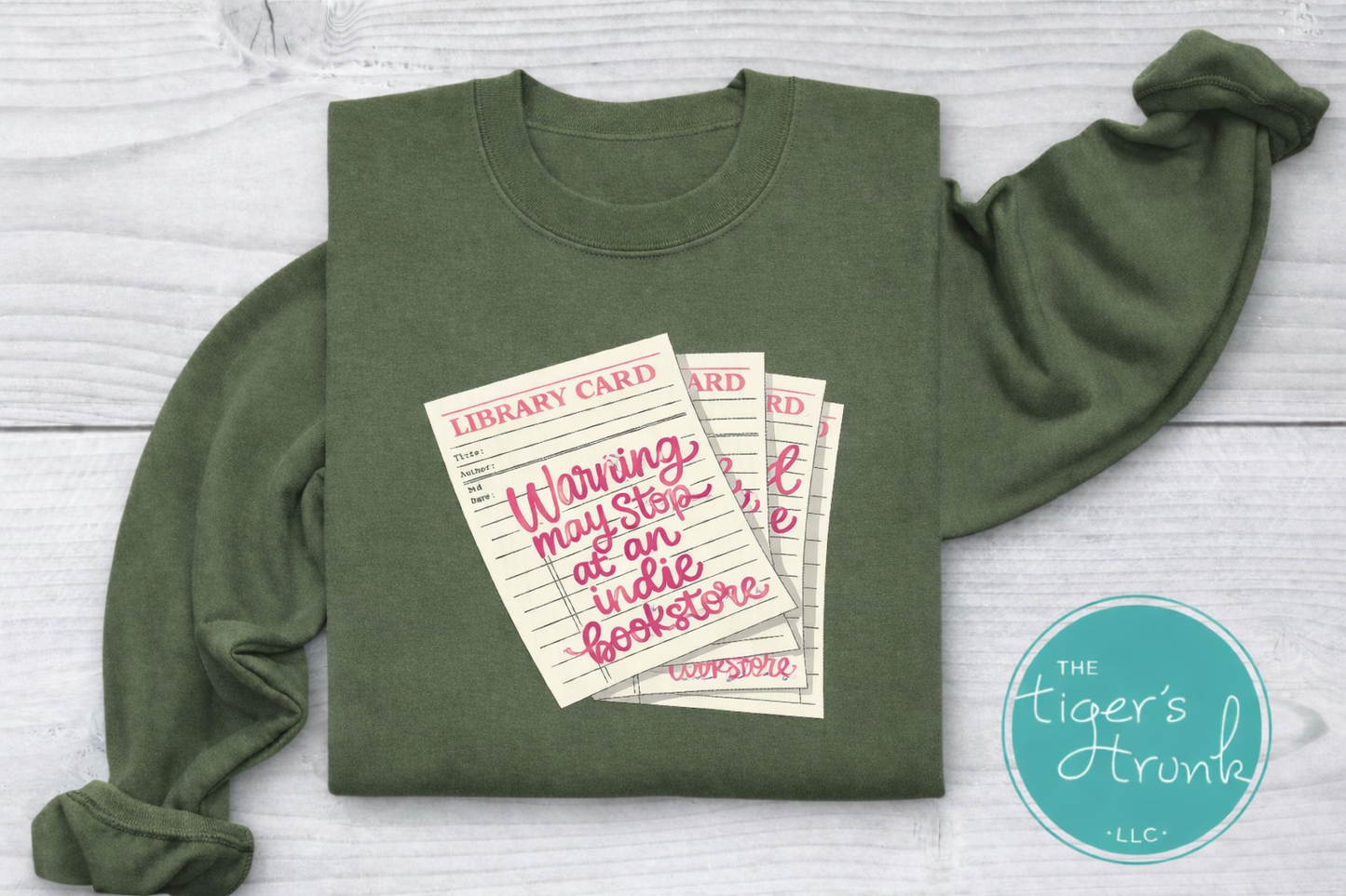 Library card shirt with warning may stop at an indie bookstore design on cream, navy, mauve, sage, sand, fatigue green, and maroon shirts