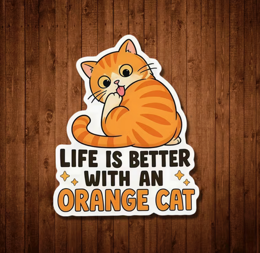 Three-inch Life Is Better With an Orange Cat die-cut sticker featuring a cute orange tabby with big eyes, pink tongue, curled tail, golden stars, and bold lettering.