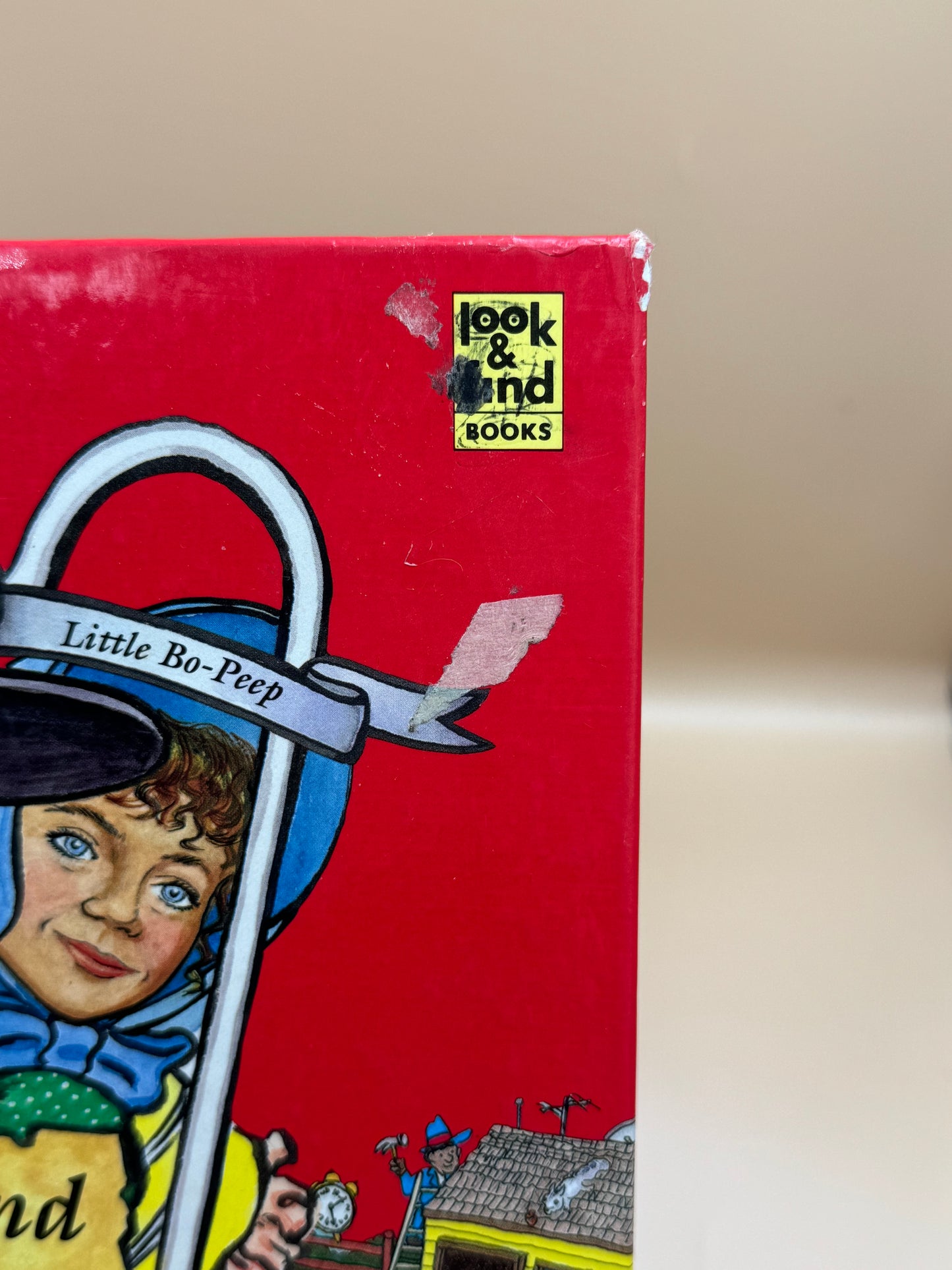 Red book cover with illustration of a child and 'Look and Find Books' logo