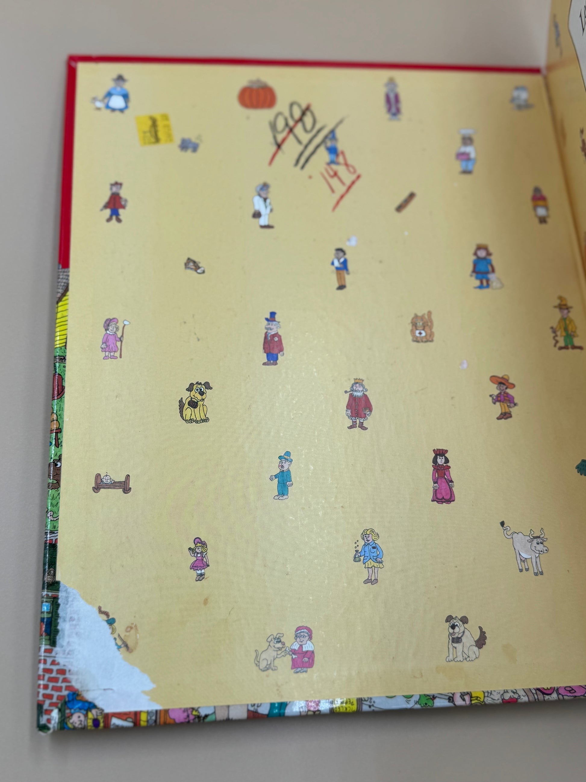 Illustrated book with small figures on a beige background