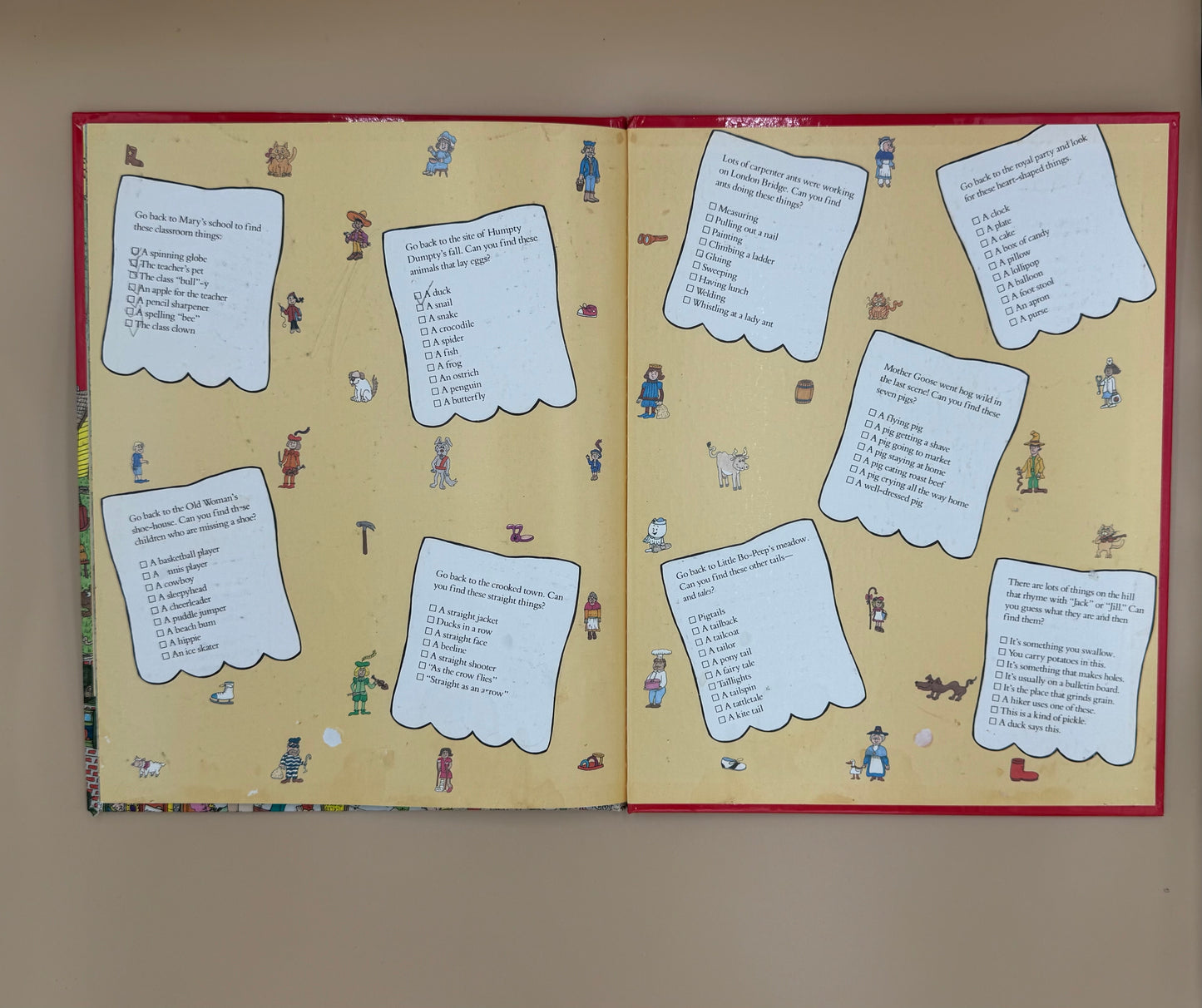 Open book with text and illustrations on a beige background