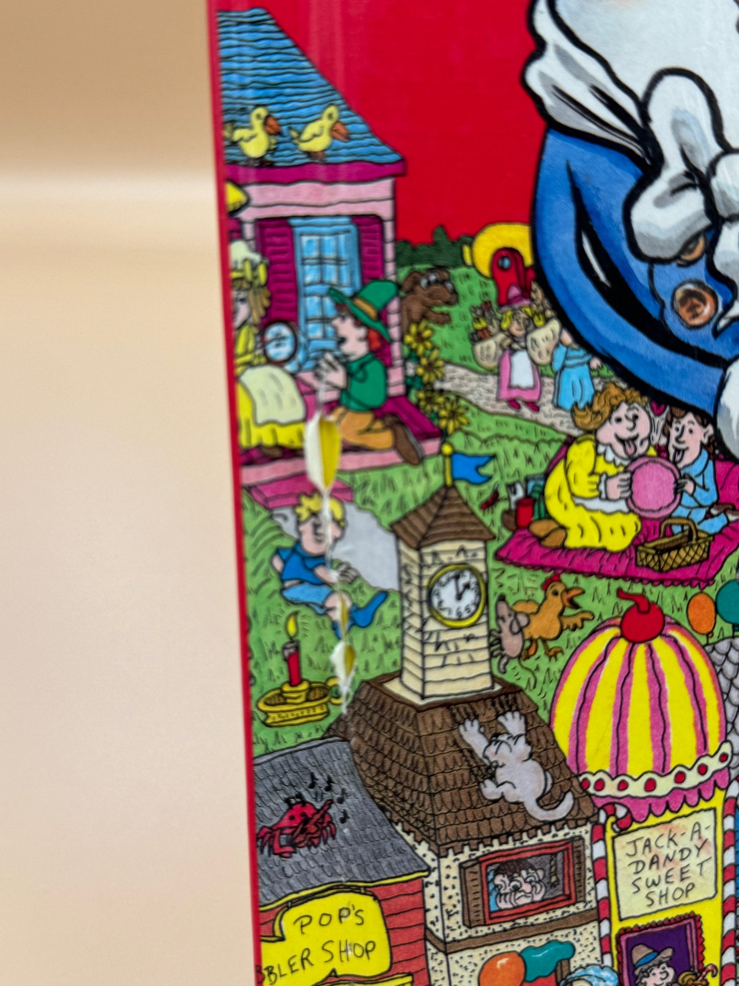 Cartoon scene with colorful buildings and characters on a red background