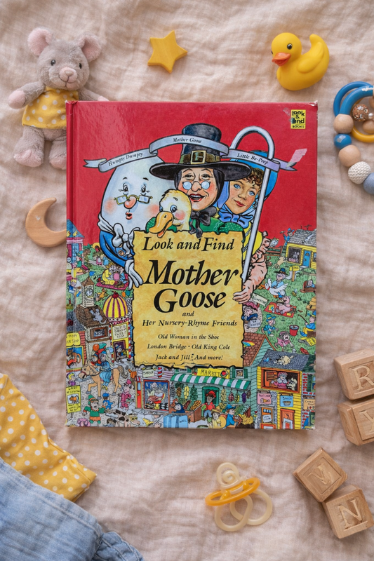 Children's book titled 'Look and Find Mother Goose' surrounded by toys on a soft surface