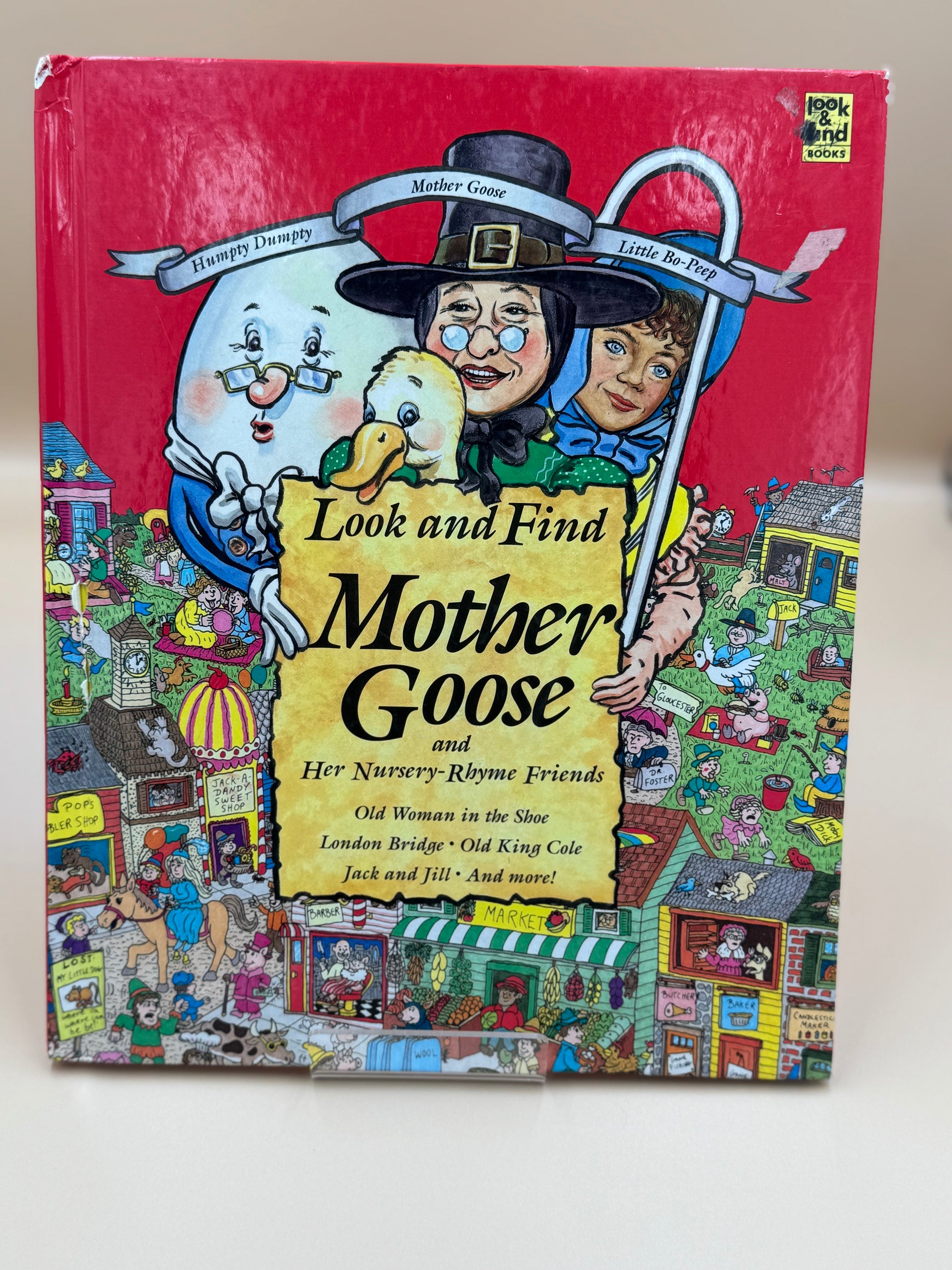 Book cover of 'Look and Find Mother Goose' with colorful illustrations on a red background