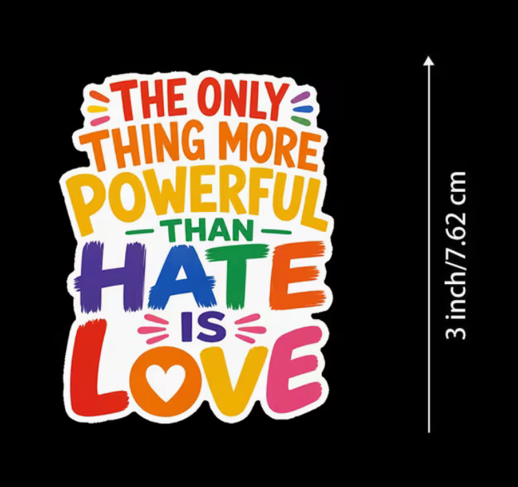 Colorful The Only Thing More Powerful Than Hate Is Love 3-inch sticker displayed on wood