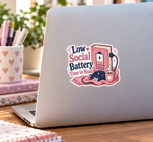 Cute Low Social Battery Time to Read sticker featuring a sleeping black cat, pink charging book, cozy blanket, and coffee mug, approximately 2 inches wide.