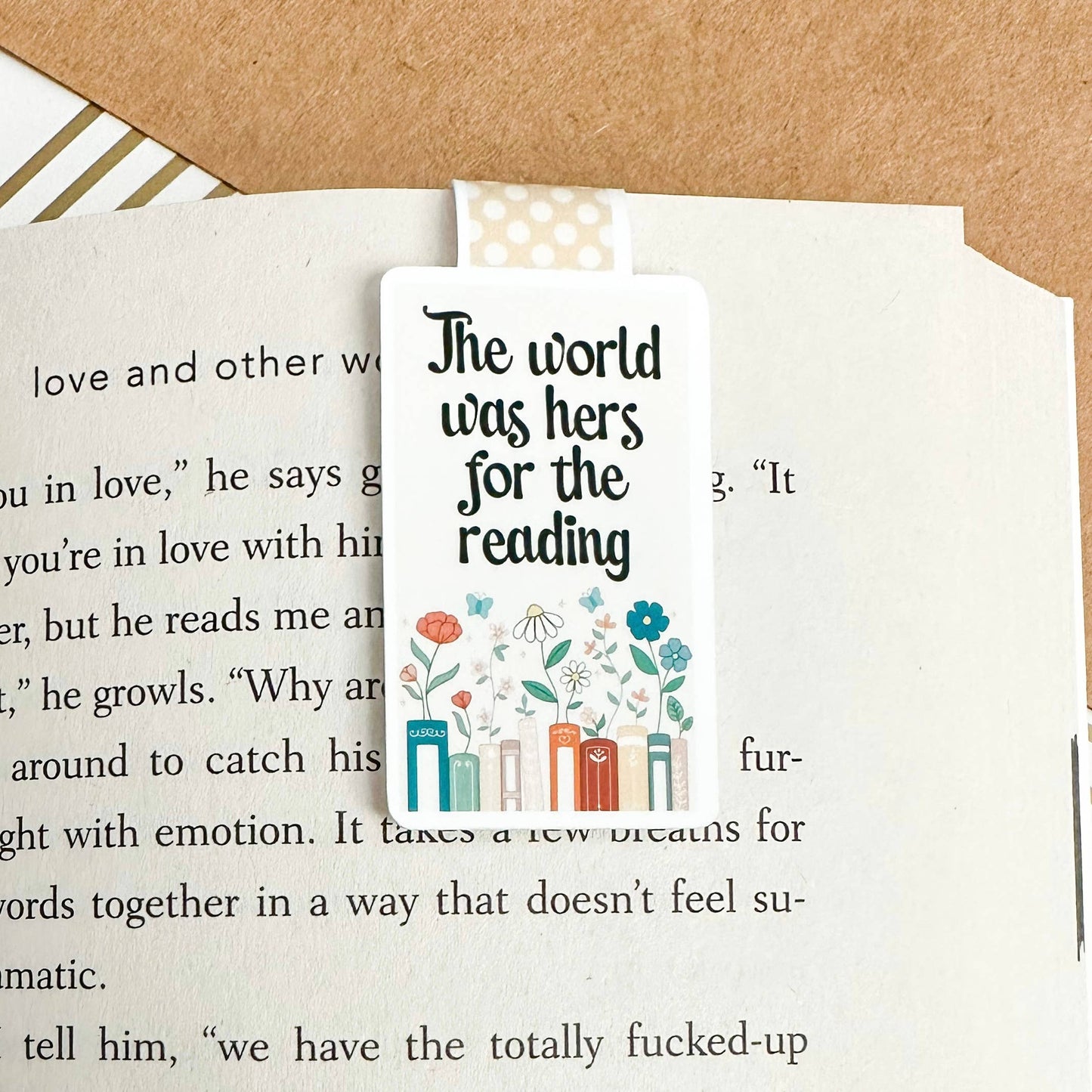 Magnetic bookmark with "The World Was Hers for the Reading" phrase, perfect for book lovers and literary enthusiasts.