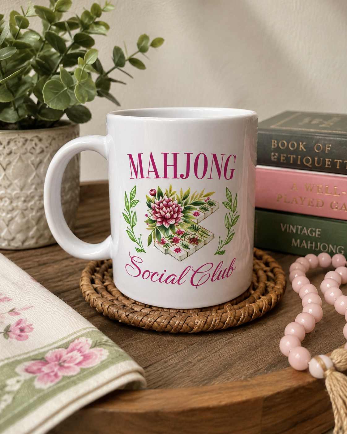 White ceramic coffee mug featuring a floral Mahjong tile design with the words "Mahjong Social Club."