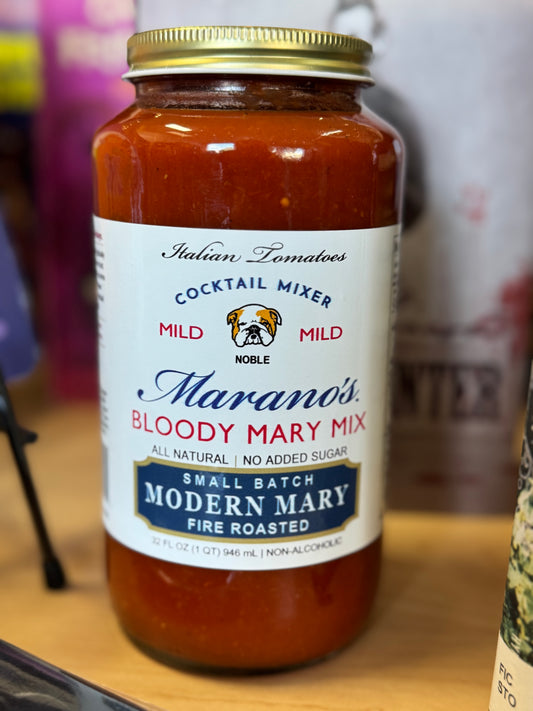 Jar of Marano's Bloody Mary Mix on a wooden surface with a blurred background