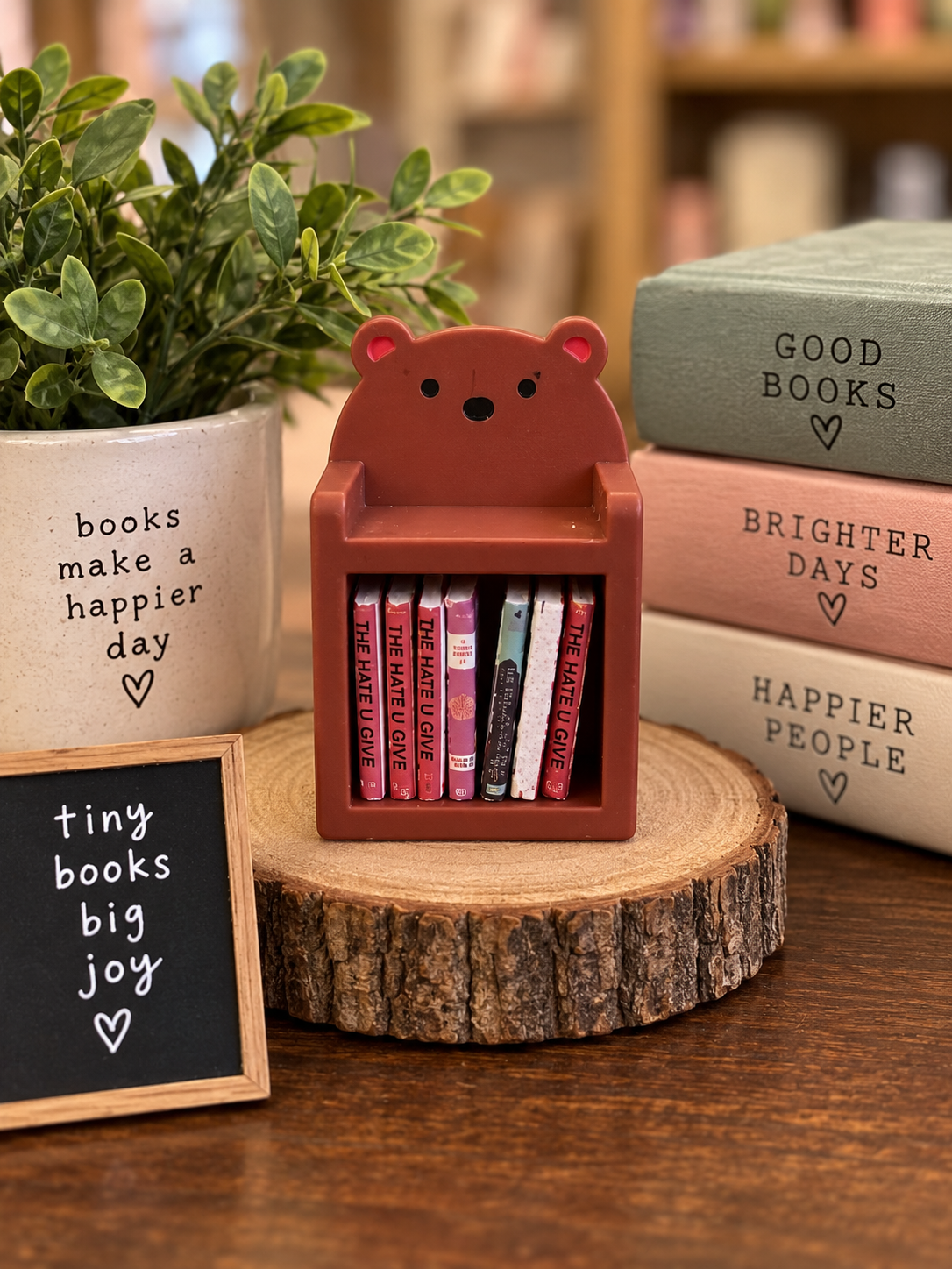 Brown mini bear bookshelf with 10 tiny books, approximately 2 x 1.3 inches
