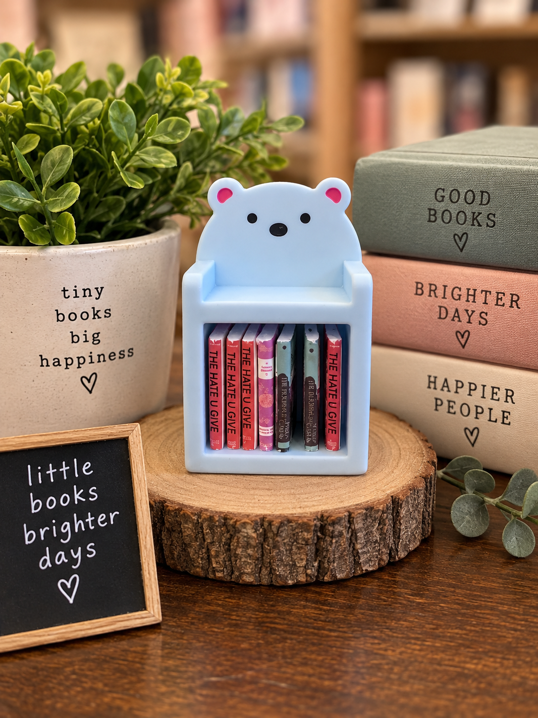 Pale blue mini bear bookshelf with 10 tiny books, approximately 2 x 1.3 inches