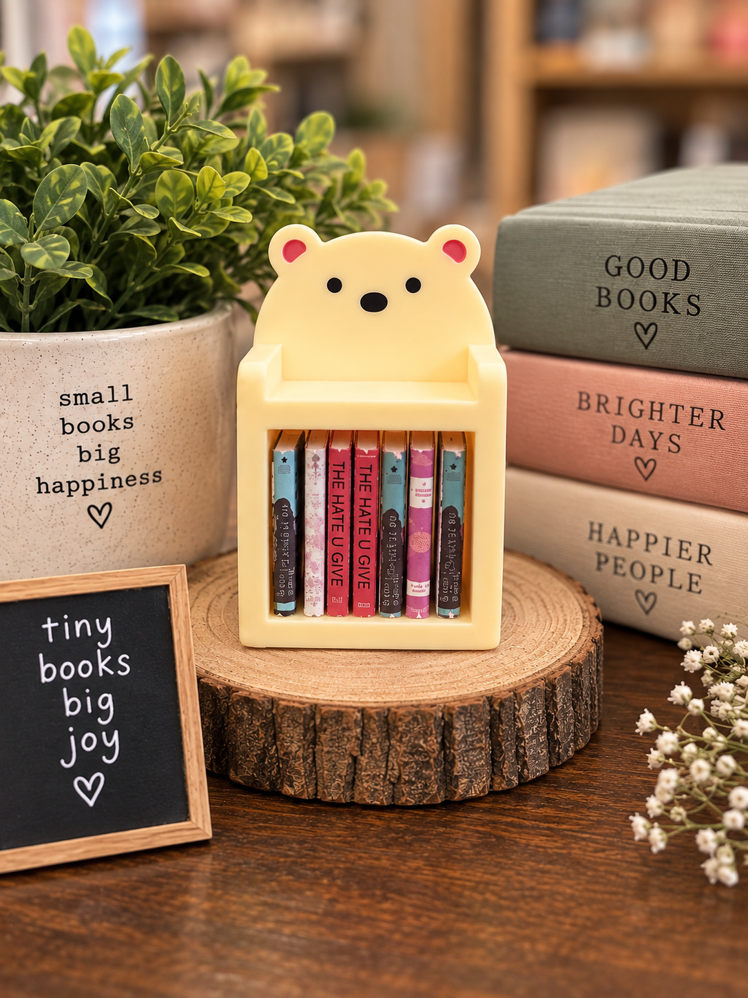 Yellow mini bear bookshelf with 10 tiny books, approximately 2 x 1.3 inches
