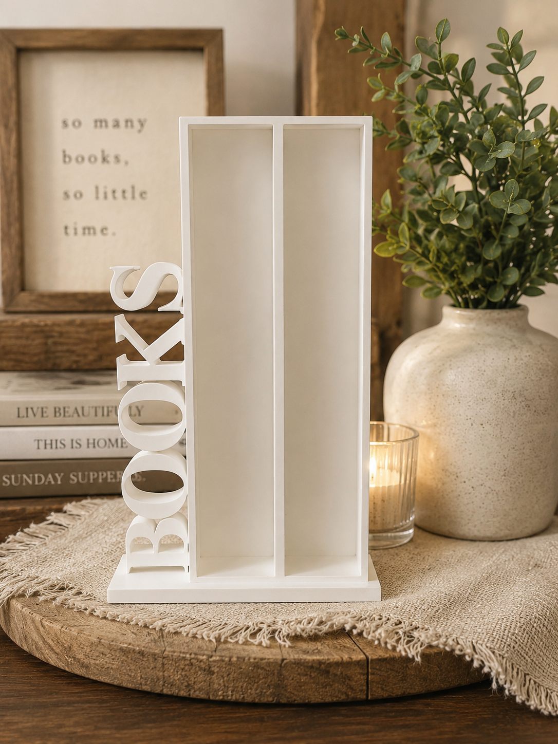 White 6.75-inch miniature bookcase with two shelves and BOOKS lettering displayed empty on a cozy tabletop.