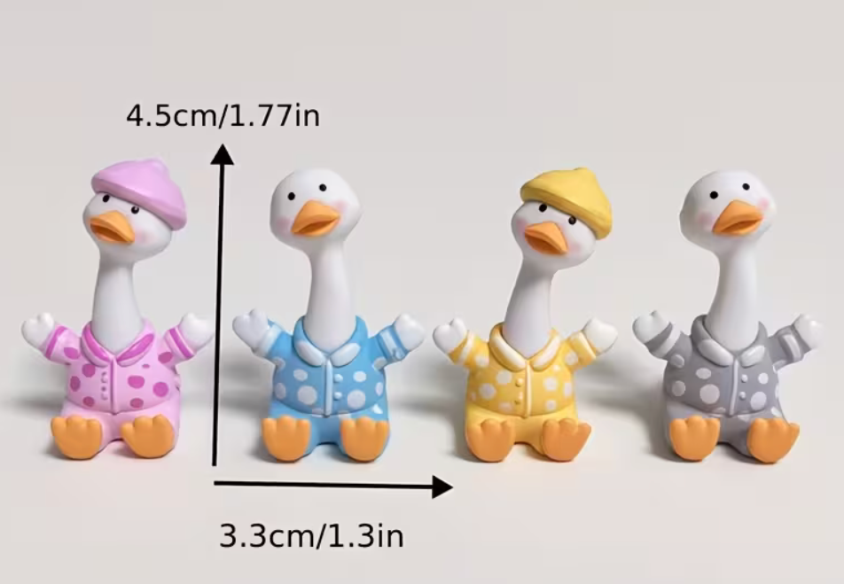 Mini resin pajama goose figurines in pink blue yellow and gray showing approximately 1.77 inch height