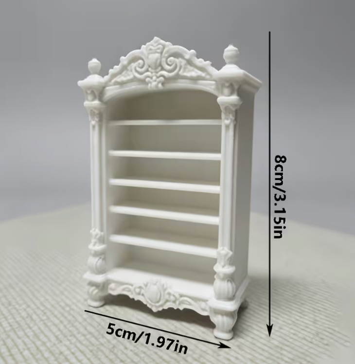 A miniature white decorative bookshelf or cabinet with four shelves, shown with dimension labels indicating a height of 8cm (3.15in) and a width of 5cm (1.