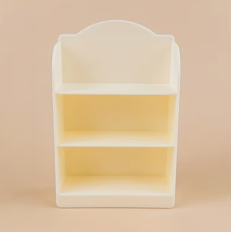 miniature cream colored bookshelf display with three shelves for tiny books and dollhouse decor