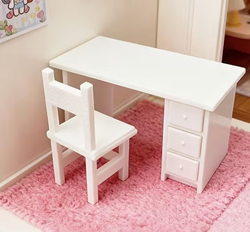 Miniature white desk and chair set with three pull-out drawers for dollhouses, dioramas, fairy gardens, and miniature office scenes.