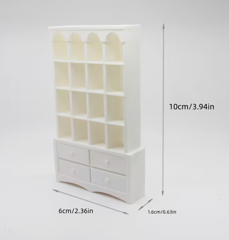 Miniature white bookcase with shelves and four drawers measuring approximately 3.94 inches tall by 2.36 inches wide.