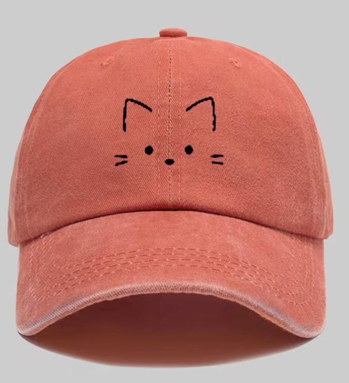 Coral vintage distressed adjustable baseball cap with minimalist black embroidered cat face