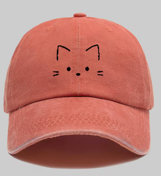 Coral vintage distressed adjustable baseball cap with minimalist black embroidered cat face