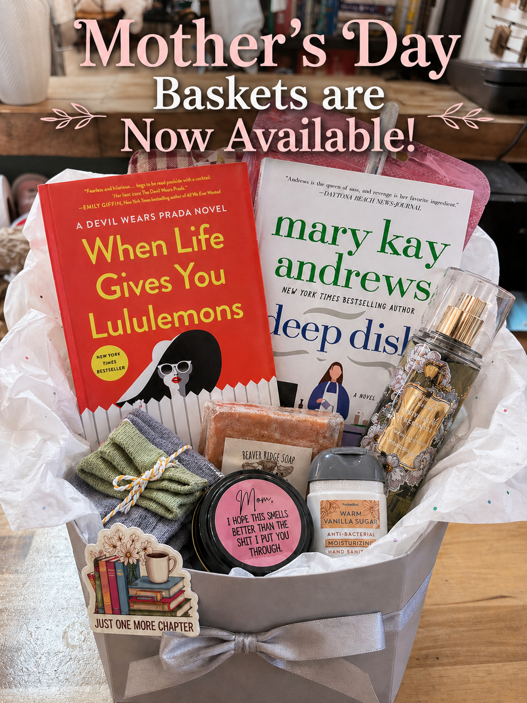 Mother’s Day gift basket with books, self-care items, and goodies, styled in a box with ribbon and text overlay announcing availability