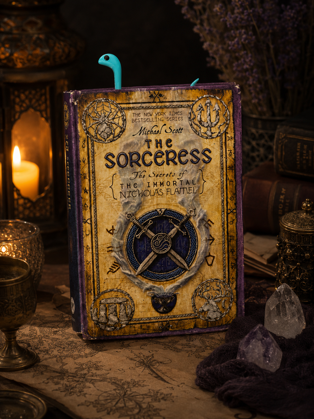 Fantasy book titled 'The Sorceress' on a mystical table with candles and crystals.