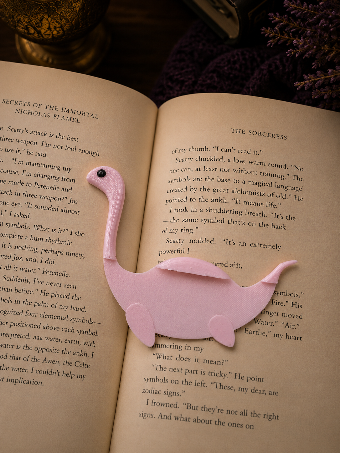 Pink flamingo-shaped bookmark on an open book