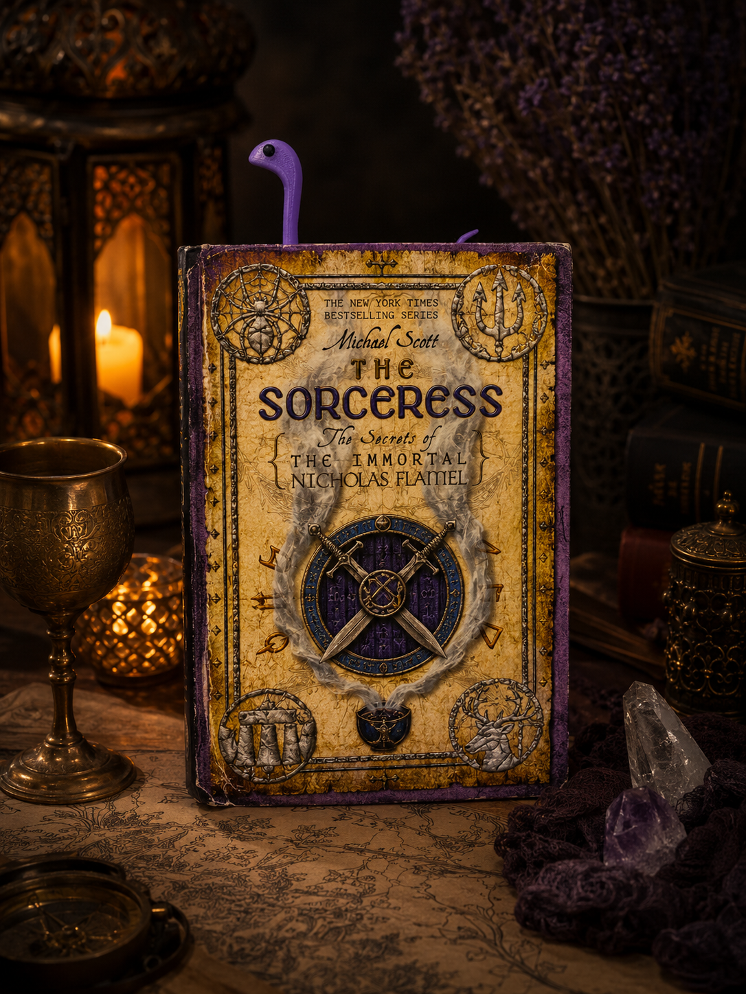 Book titled 'The Sorceress' with mystical decor around it
