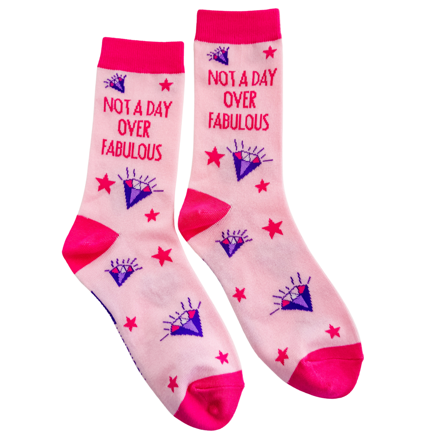 Pink novelty crew socks reading Not a Day Over Fabulous with purple diamond and red star design, soft cotton blend socks shown on white background for gift and everyday wear