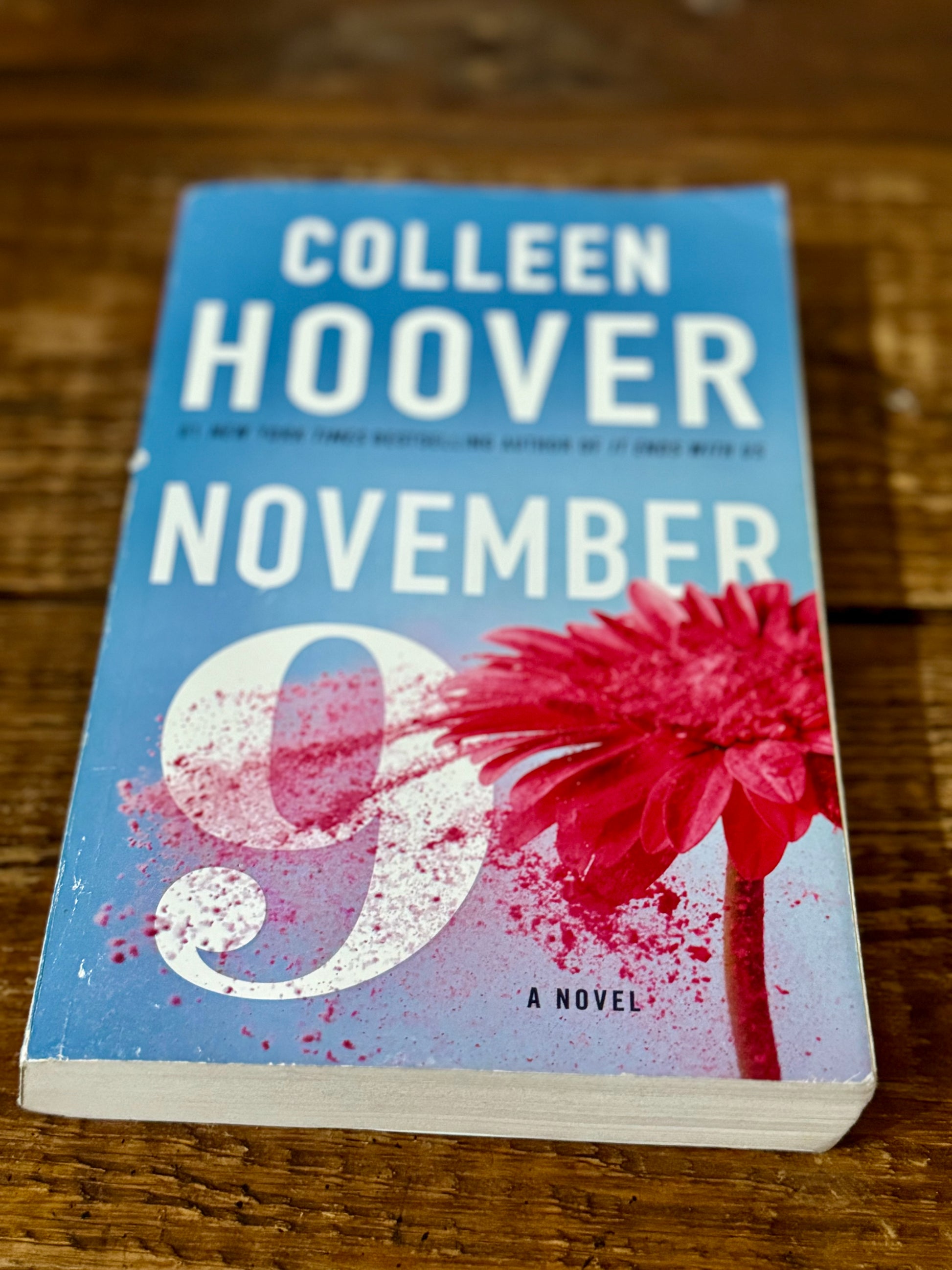 November 9 by Colleen Hoover, a paperback contemporary romance in good used condition, perfect for fans of heartfelt love stories.