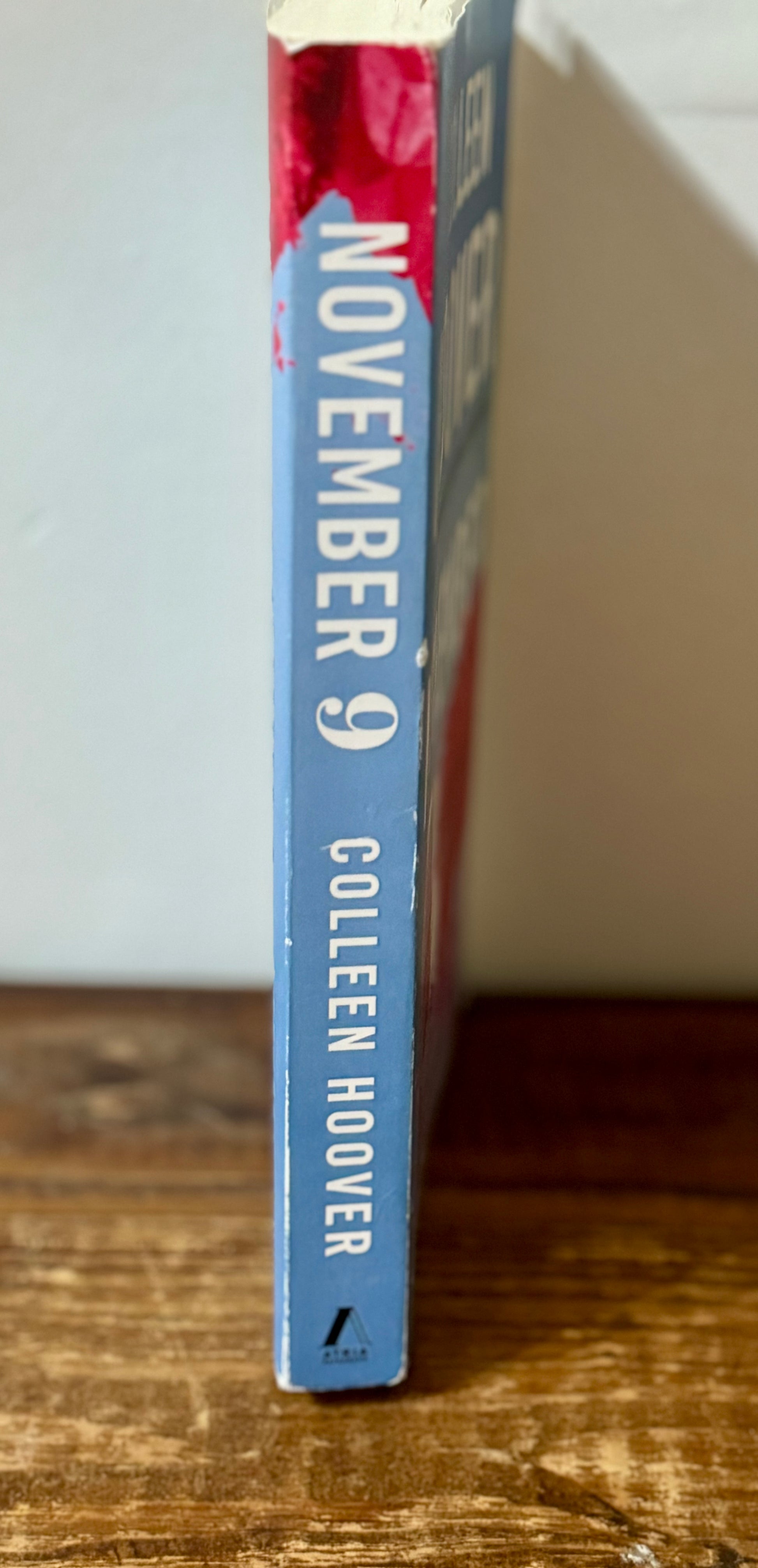 November 9 by Colleen Hoover, a paperback contemporary romance in good used condition, perfect for fans of heartfelt love stories.