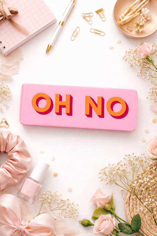 Large novelty pink eraser with the words Oh No printed on it displayed as a funny desk accessory