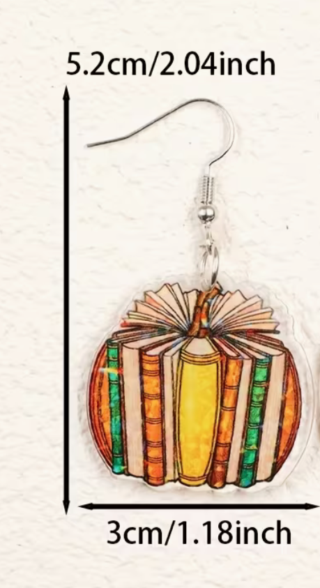 Book pumpkin acrylic earring with silver-tone fishhook ear wire measuring approximately 2.04 inches long and 1.18 inches wide