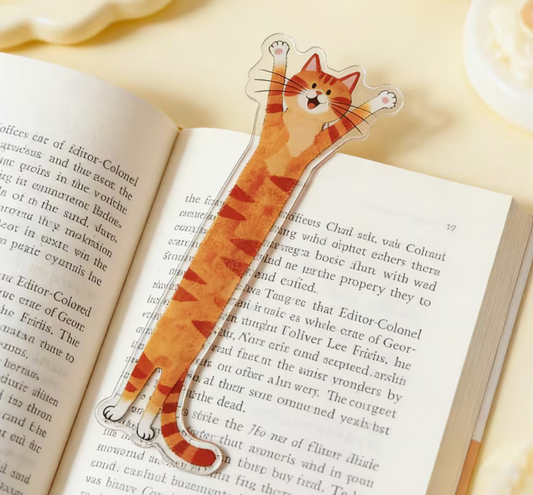 Orange acrylic cat bookmark shaped like a stretching kitten inside an open book