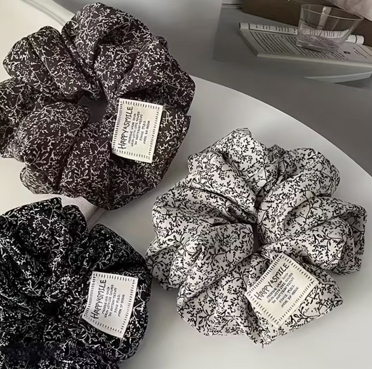 Oversized 4.72 inch floral scrunchies in black and blush pink with delicate vintage-inspired botanical patterns