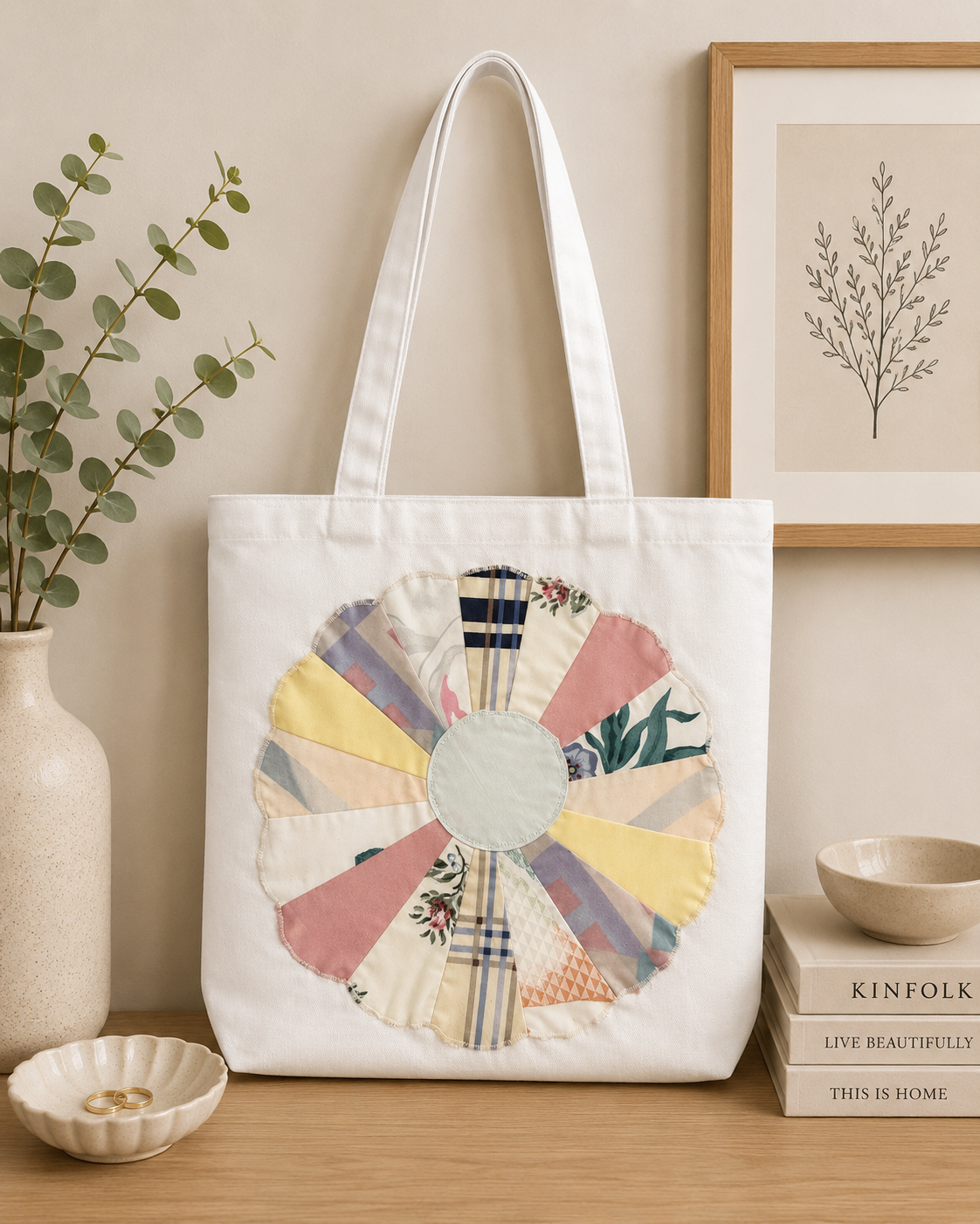 White canvas tote bag featuring pastel floral circular quilt-inspired patchwork design